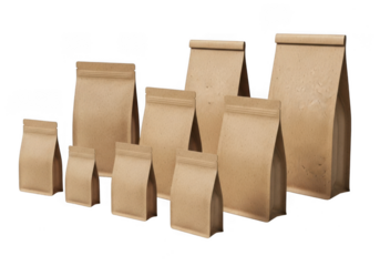 Collection of various sized brown paper pouches with flat bottoms isolated on transparent background