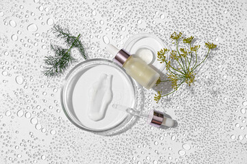 Composition with bottle of dill cosmetic product and Petri dishes and samples in water on white...