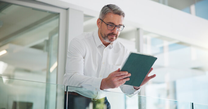 Tablet, planning and research with business man in office for key account manager, roi project and reading. Funding review, budget admin and digital report with mature person in agency as advisor