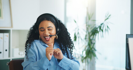 Fototapeta premium Dancing, agent and woman with headset, call center and excited for complete target, win and success. Sales, consultant and person with mic for communication, happy and celebration for bonus in office