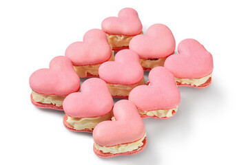Many sweet heart-shaped macaroons on white background. Valentine's Day celebration