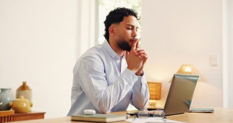 Laptop, reading and thinking with business man in home office for problem solving or research. Computer, planning and remote work with freelance employee at desk in apartment for startup ideas