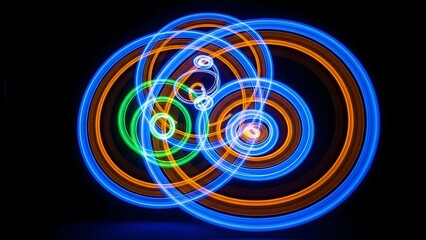 Abstract Light Painting with Vibrant Circular Patterns on Black Background