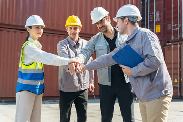 Group of Warehouse Workers Celebrating Teamwork and Achievement at Cargo Port, Industrial Engineers Stacking Hands, Diverse Logistics Team Showing Unity and Partnership in Container Yard