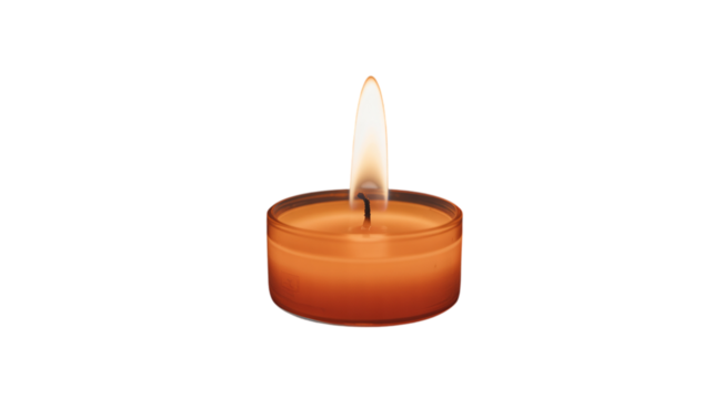 Burning orange tea light candle providing warm glowing light