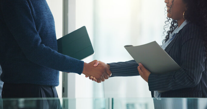 Handshake, tablet and business people in office with deal, finance contract or partnership. Folder, negotiation and financial manager shaking hands with client for investment proposal in workplace. - Powered by Adobe