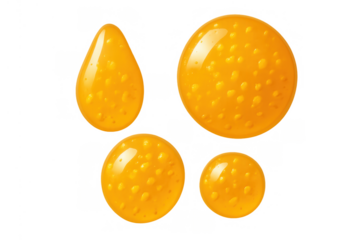 Yellow textured liquid drops and blobs splashing, sweet syrup fluid flowing, transparent background