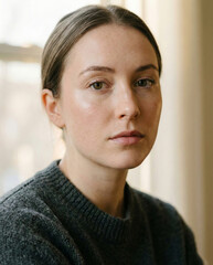 Confident young woman looking at camera