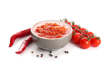 Bowl with tasty tomato sauce and ingredients isolated on white background, closeup