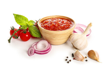 Bowl with tasty tomato sauce and ingredients isolated on white background, closeup