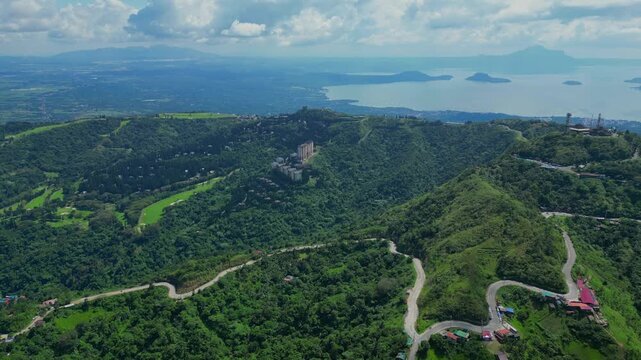 A wide aerial of the winding hill road near People's Park in the Sky in Tagaytay, Cavite, Philippines