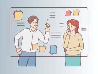 Business Team Discussing Project Plan on Whiteboard Sticky Notes 