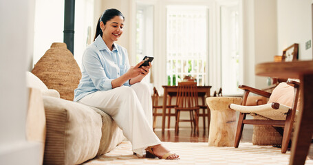 Couch, reading and happy woman typing with phone on weekend, social network or check message app for alert. Notification, digital communication or person texting in home, email reply or online chat