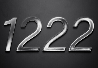 Chrome metal 3D number design of 1222 on grey background.