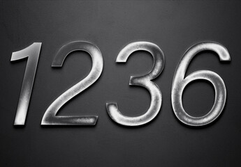 Chrome metal 3D number design of 1236 on grey background.