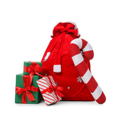 Santa Claus bag, gifts and candy cane isolated on white background