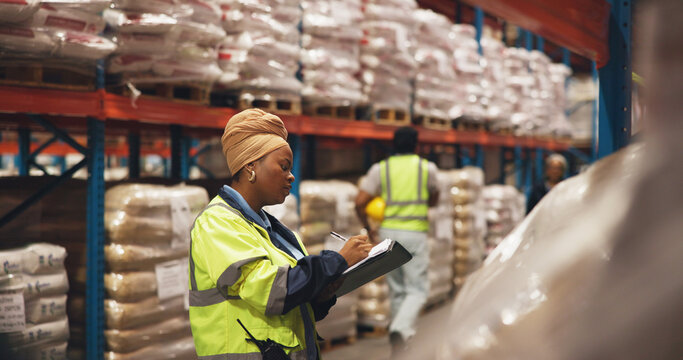 Writing, clipboard and logistics with woman in warehouse for shipping checklist, supply chain and quality control. Export, inventory manager and ecommerce supplier with employee in factory for review - Powered by Adobe