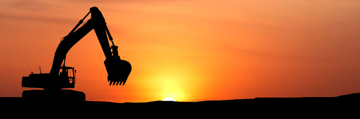 for banner Silhouette of a powerful excavator at sunset, representing industry and construction