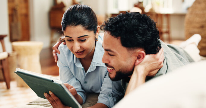 Tablet, couple and hug in lounge to watch movies, search subscription website or check app for new release. Home, weekend bonding and happy people relax with support, streaming film together or tech