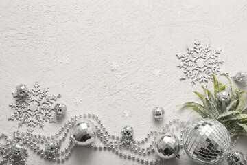 Composition with disco balls and Christmas decor on white grunge background