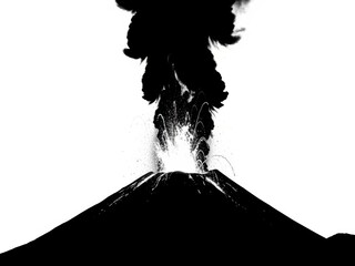 Silhouette of erupting volcano with ash cloud and lava