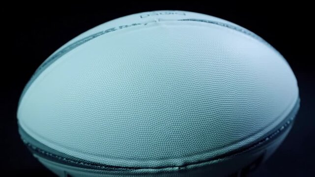 Close up view of textured oval ball under studio lighting