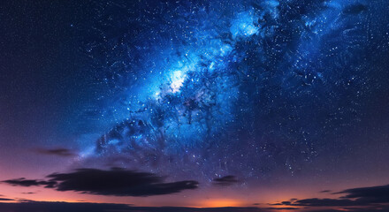 Obraz premium Stunning Milky Way Galaxy over Colorful Horizon Night Sky