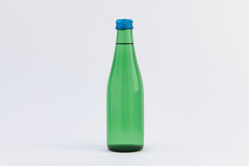 Bottle of water isolated on white background. Green plastic bottle.