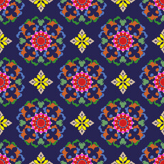 Multicolor damask ethnic floral seamless pattern. Vector abstract kaleidoscope fabric design texture.  Retro vintage style. Ideas for textiles, wallpapers, rugs, curtains, and tapestry art.