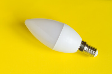 Modern LED lamp on a yellow background. New LED Lamp Close-Up