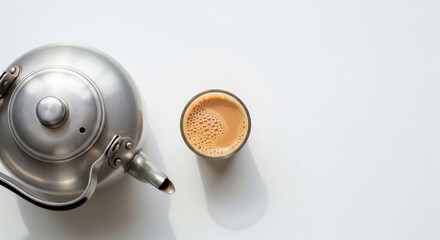 Traditional Indian Chai Kettle and Frothy Milk Tea