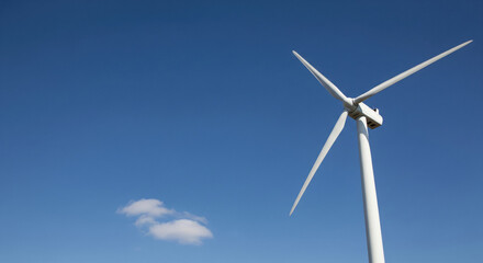 Wind Turbine Against Blue Sky Generating Clean Power