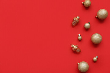 Composition with golden Christmas balls on red background