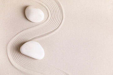 Naklejka premium Composition with stones and lines on sand as background. Zen concept
