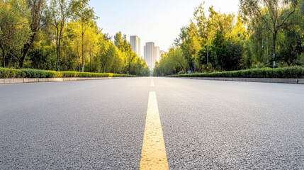 Empty road sunrise tree lined avenue with distant city skyline and calm mood