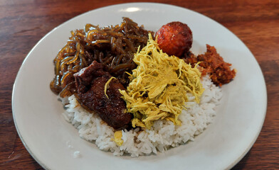 Nasi Campur Bali with Shredded Chicken, Spiced Egg, and Traditional Side Dishes