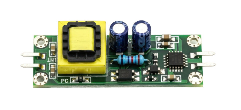 Close-up view of a green electronic circuit board with various components. - Powered by Adobe