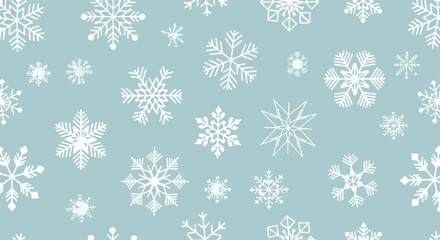 A festive and delicate seamless pattern of various white snowflakes scattered across a calm blue background, ideal for Christmas and winter holiday designs