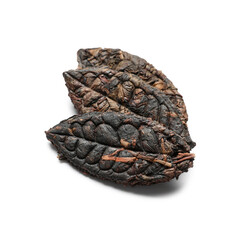 Dry pressed puer tea in shape of leaves on white background