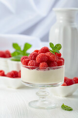 Panna cotta with fresh raspberries.