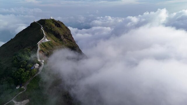 Top View Mulayit Taung golden light of the morning sun and the mist covered on Mount Mulayit,Myanmar

