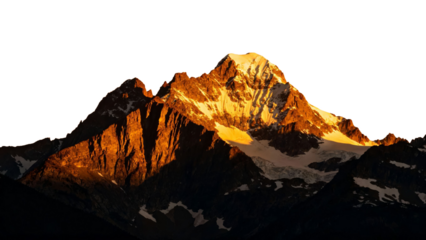 Sunlit mountain peak with rugged cliffs and snow patches at dawn