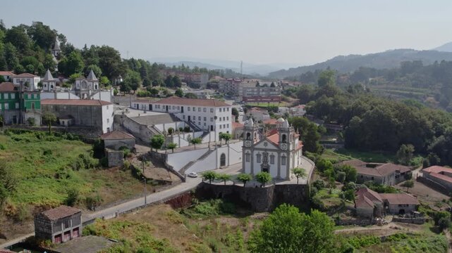 drone shot above the porto de ave sanctuary and surrounding rural landscape