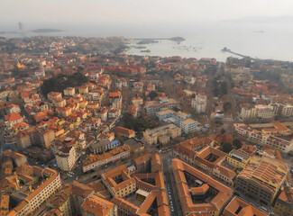 Obraz premium Qingdao Harbor Aerial View With Red Tile Roofs and Coastal Architecture