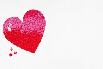 Close-up of a Valentine's heart puzzle concept for building love piece by piece.