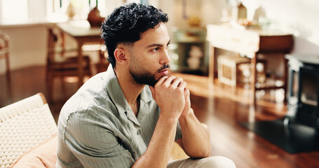 Home, thinking and man on sofa, ideas and contemplation with decision, calm and thoughtful. Apartment, problem solving and person on couch, choice and planning for daily activity, solution and memory