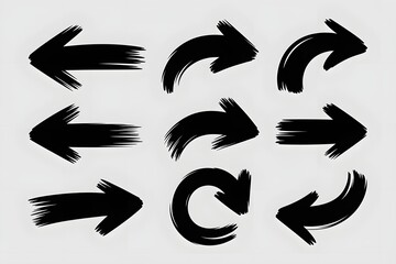 Collection of nine black hand drawn brush stroke arrows