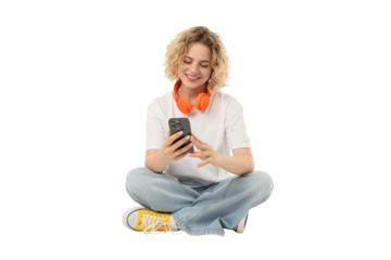 Person engages with smartphone and enjoys music, isolated, PNG