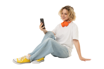 Woman enjoys music and social media on her phone, isolated, PNG