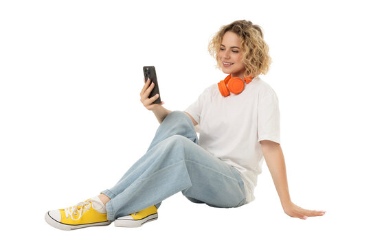 Woman enjoys music and social media on her phone, isolated, PNG
